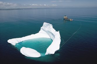 Randy Olson, Towing an iceberg away from a collision course with the Hibernia oil platform, Grand Banks, Newfoundland, 2005. Photo: Randy Olson / National Geographic Creative, Courtesy Canadian Centre for Architecture