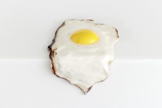 Christopher Chiappa, Single Fried Egg, 2015, Paint, epoxy resin and fiberglass on plaster, dimensions variable. Courtesy the artist and Kate Werble Gallery-New York