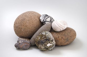 Brad Miller, Untitled (Stones), 2017, Ceramic, hand-formed and tumbled, Dimensions variable, Courtesy Edward Cella Art + Architecture Gallery