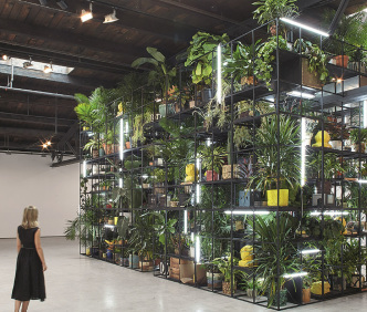 Rashid Johnson, Antoine’s Organ, 2016, Performance, Black steel, grow lights, plants, wood, shea butter, books, monitors, rugs, piano, 858.5 × 480.1 × 321.9 cm, Hauser & Wirth, © Art Basel