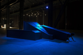 Mike Kelley, Rose Hobart II, 2006, Installation view, “Mike Kelley. Eternity is a Long Time” Pirelli HangarBicocca, 2013, Wood, metal, carpet, acrylic paint, with video projection and sound, 182.9 x 452.1 x 609.6 cm, © Mike Kelley Foundation for the Arts. All Rights Reserved/VAGA at ARS-NY, Courtesy the Foundation and Hauser & Wirth