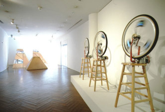 Shigeko Kubota, Duchampiana: Bicycle Wheel One, Two, Three and Three Mountains, Installation view at Hara Museum of Contemporary Art, 1992, Photo by Yoshitaka Uchida, Courtesy of Shigeko Kubota Video Art Foundation; © Estate of Shigeko Kubota