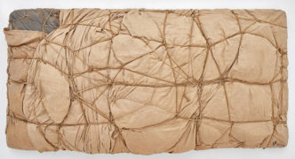 Christo, Package, 1958 Fabric, lacquer, and rope, 14 ⅝ × 10 ¼ × 6 ⅜ inches (37 × 26 × 16 cm)© Christo and Jeanne-Claude Foundation. Photo: Thomas Lannes