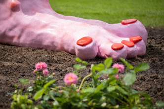 Mika Rottenberg, Foot Fountain (pink), 2024, Acrylic resin, glass fiber, stainless steel, polyurethane paint, water technology, bituminous, 300 x 184,9 x 106,6 cm, Installation view of Mika Rottenberg. Antimatter Factory, at Museum Tinguely, Basel, 2024, © Mika Rottenberg, Courtesy the artist and Hauser & Wirth Photo: 2024 Museum Tinguely, Basel; Matthias Willi