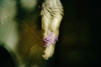 Nan Goldin, Lilacs between Jesus’s legs, Aubazine church, France, 2005. Archival pigment print, 40 × 60 inches (101.6 × 152.4 cm), edition of 3 + 1 AP, © Nan Goldin, Courtesy the artist and Gagosian